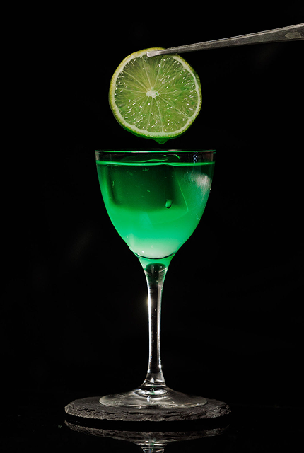 Elegant bartender crafting signature cocktails at upscale corporate event